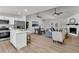 Open-concept living space featuring a modern kitchen, dining area, and living room at 202 Basswood Ave, Summerville, SC 29483