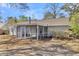 Enclosed sunroom perfect for enjoying the outdoors while protected from the elements, providing versatile living space at 202 Basswood Ave, Summerville, SC 29483