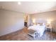 Bright bedroom featuring a comfortable queen bed with a beautiful ensuite bathroom entrance at 2293 Old Hwy 6, Cross, SC 29436