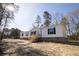 Charming single story home with wooden front porch and black shutters and a beautiful outdoor space at 2293 Old Hwy 6, Cross, SC 29436