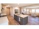 Spacious kitchen boasts an island with seating, stainless steel appliances, and a seamless flow to the living area at 2293 Old Hwy 6, Cross, SC 29436