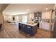 Spacious kitchen boasts an island with seating, stainless steel appliances, and a seamless flow to the dining area at 2293 Old Hwy 6, Cross, SC 29436