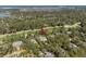 Beautiful aerial view of house surrounded by lush greenery, golf course and scenic marsh views at 2440 Cat Tail Pond Rd, Seabrook Island, SC 29455