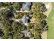 Aerial view of the property showing proximity to golf course, mature trees, and manicured lawns at 2440 Cat Tail Pond Rd, Seabrook Island, SC 29455