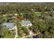 Aerial view of home with mature trees, long driveway, and proximity to the golf course at 2440 Cat Tail Pond Rd, Seabrook Island, SC 29455