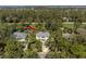 Aerial shot showcases property's mature trees, long driveway and surrounding landscape at 2440 Cat Tail Pond Rd, Seabrook Island, SC 29455