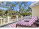 Outdoor balcony with flower boxes and lounge chairs overlooking green area at 2440 Cat Tail Pond Rd, Seabrook Island, SC 29455