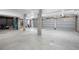 Spacious basement with concrete floor, block walls, and multiple garage doors offers ample storage and parking at 2440 Cat Tail Pond Rd, Seabrook Island, SC 29455