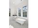 Elegant bathroom featuring a clawfoot tub, mosaic tile floor, and bright natural light at 2440 Cat Tail Pond Rd, Seabrook Island, SC 29455