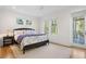 Well-lit bedroom with a cozy bed, a ceiling fan and outside views at 2440 Cat Tail Pond Rd, Seabrook Island, SC 29455