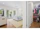 Bright bedroom with French doors to balcony, walk-in closet, and neutral decor at 2440 Cat Tail Pond Rd, Seabrook Island, SC 29455