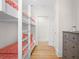 Bright bedroom featuring built-in bunk beds with patterned bedding at 2440 Cat Tail Pond Rd, Seabrook Island, SC 29455
