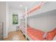 Bright bedroom featuring built-in bunk beds with patterned bedding at 2440 Cat Tail Pond Rd, Seabrook Island, SC 29455