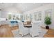 Dining area with hardwood floors, bar seating, and seamless access to the kitchen at 2440 Cat Tail Pond Rd, Seabrook Island, SC 29455