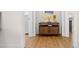 Inviting entryway with wood floors and charming console table and artwork at 2440 Cat Tail Pond Rd, Seabrook Island, SC 29455