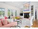Cozy living room featuring a fireplace, built-in shelving, and french doors to the exterior at 2440 Cat Tail Pond Rd, Seabrook Island, SC 29455