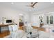 Spacious living room featuring hardwood floors, light walls, and French doors leading to the outside at 2440 Cat Tail Pond Rd, Seabrook Island, SC 29455