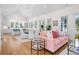 Open-concept living room with vaulted ceiling, hardwood floors, and a seamless flow to the kitchen at 2440 Cat Tail Pond Rd, Seabrook Island, SC 29455