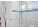 Bright shower featuring light tile, glass door, and stylish accents at 2440 Cat Tail Pond Rd, Seabrook Island, SC 29455
