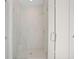 Modern walk-in shower with glass door and white tile surround at 2440 Cat Tail Pond Rd, Seabrook Island, SC 29455