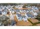 Real estate aerial view of a community featuring a lake, walking trails, and various home styles at 2545 Hatch Dr, Johns Island, SC 29455