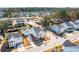 Aerial view of a Primary-planned community with tree-lined streets, community pool, and lake at 2545 Hatch Dr, Johns Island, SC 29455
