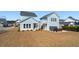 Light blue house featuring a detached in-law suite, fenced in yard and a hot tub at 2545 Hatch Dr, Johns Island, SC 29455