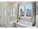 Spa-like bathroom with a soaking tub, glass enclosed shower, and bright natural light at 2545 Hatch Dr, Johns Island, SC 29455