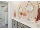 Stylish bathroom with a double sink vanity, decorative mirrors, and a shower-tub combination at 2545 Hatch Dr, Johns Island, SC 29455