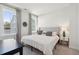Bright bedroom featuring a large bed, neutral tones, and natural light from the windows at 2545 Hatch Dr, Johns Island, SC 29455
