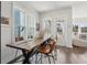 Charming dining area with rustic wood table, leather chairs, and abundant natural light at 2545 Hatch Dr, Johns Island, SC 29455