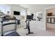 Bright fitness room equipped with a treadmill and stationary bike for a complete workout at 2545 Hatch Dr, Johns Island, SC 29455