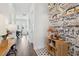Charming hallway with patterned wallpaper, wood floors, and a decorative bar cabinet at 2545 Hatch Dr, Johns Island, SC 29455