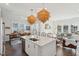 Open kitchen with island seating, pendant lighting, flowing into dining and living areas at 2545 Hatch Dr, Johns Island, SC 29455