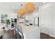 Modern kitchen featuring white cabinetry, island with seating, and stylish pendant lighting at 2545 Hatch Dr, Johns Island, SC 29455