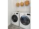 Well-lit laundry room with modern washer and dryer units, plus additional storage space at 2545 Hatch Dr, Johns Island, SC 29455