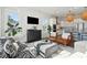 Bright living room features modern decor, natural light, and an open floor plan to the kitchen at 2545 Hatch Dr, Johns Island, SC 29455