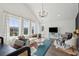 Bright living area with high ceilings, large windows, and modern furnishings with stylish decor at 2545 Hatch Dr, Johns Island, SC 29455