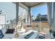 Relaxing covered patio with cozy seating, string lights, and view of the landscaped backyard at 2545 Hatch Dr, Johns Island, SC 29455