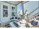Cozy covered patio with white furnishings, fire feature, and views of the neighborhood at 2545 Hatch Dr, Johns Island, SC 29455
