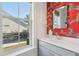 Stylish powder room featuring designer wallpaper, modern fixtures, and an open window view at 2545 Hatch Dr, Johns Island, SC 29455