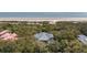 Charming home nestled among mature trees, showcasing its privacy and proximity to the beach at 263 Pelican Flight Dr, 15.4% Share, Dewees Island, SC 29451