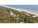 Expansive aerial shot shows property's location with beach access; indicated by arrow for clarity at 263 Pelican Flight Dr, 15.4% Share, Dewees Island, SC 29451