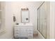 Bathroom featuring a vanity and glass enclosed shower, with a tile surround at 263 Pelican Flight Dr, 15.4% Share, Dewees Island, SC 29451