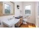 A bathroom featuring vintage vanity and fixtures at 263 Pelican Flight Dr, 15.4% Share, Dewees Island, SC 29451