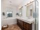 Bright bathroom featuring a double vanity, soaking tub and tile flooring at 263 Pelican Flight Dr, 15.4% Share, Dewees Island, SC 29451
