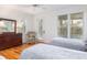 Bedroom featuring hardwood floors, two twin beds, and windows for natural light at 263 Pelican Flight Dr, 15.4% Share, Dewees Island, SC 29451