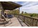 Spacious covered deck with outdoor seating and a view of the ocean and tropical landscape at 263 Pelican Flight Dr, 15.4% Share, Dewees Island, SC 29451