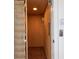 Interior view of a residential elevator with wood paneling, metal gate, and overhead lighting at 263 Pelican Flight Dr, 15.4% Share, Dewees Island, SC 29451