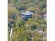 Charming home elevated among mature trees, featuring a spacious deck for outdoor enjoyment at 263 Pelican Flight Dr, 15.4% Share, Dewees Island, SC 29451